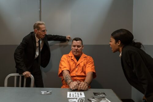 criminal being interrogated by detectives